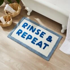 Rinse & Repeat Slogan Bath Mat
